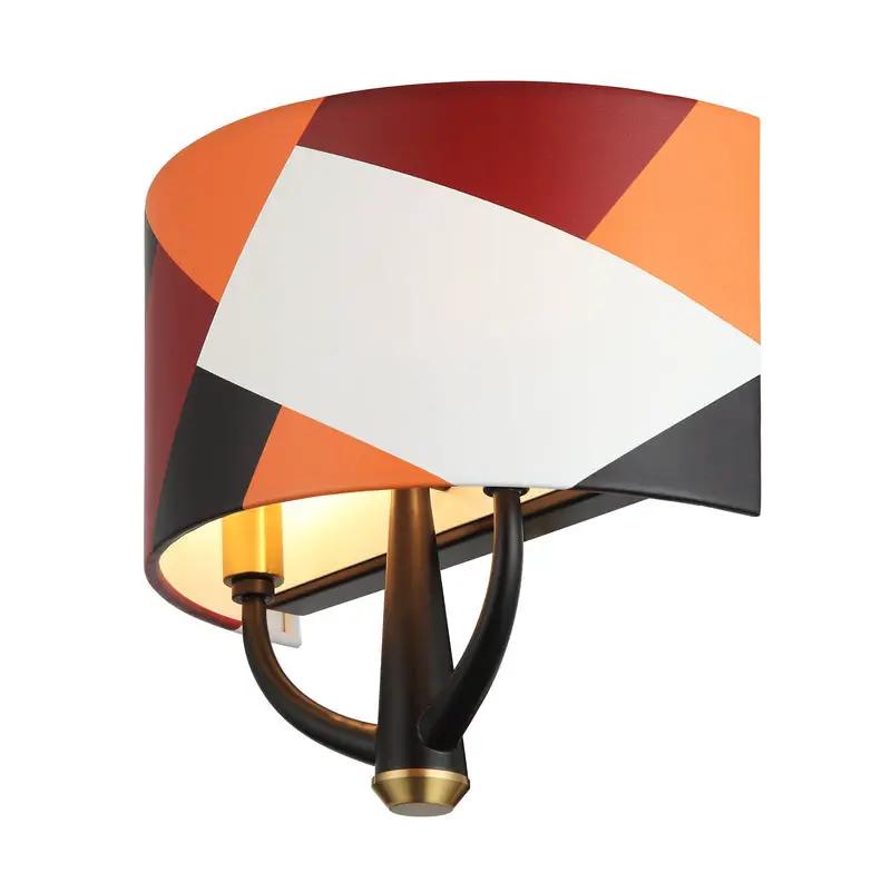 black/satin brass/patchwork wall mount light