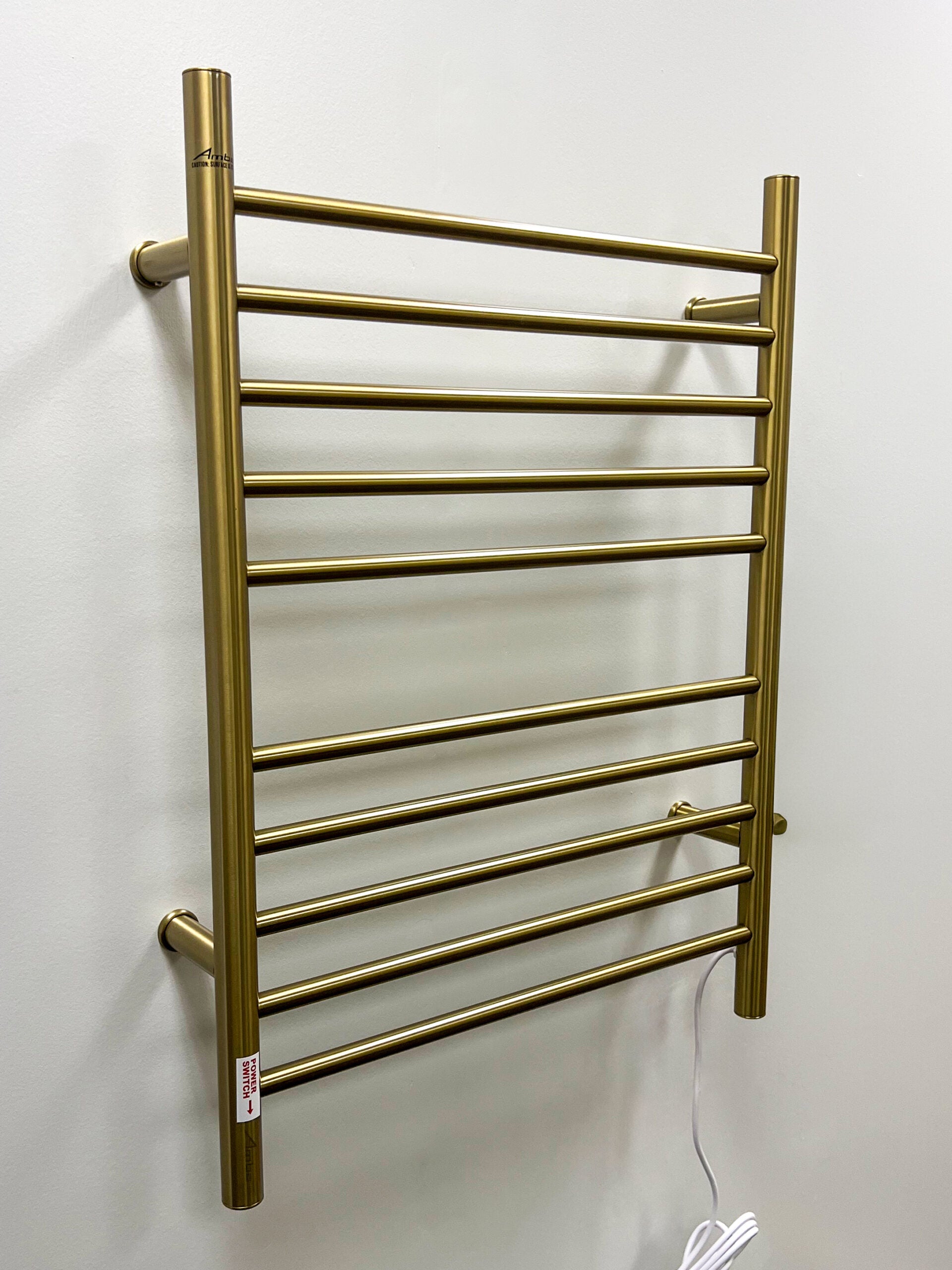 polished gold towel warmers
