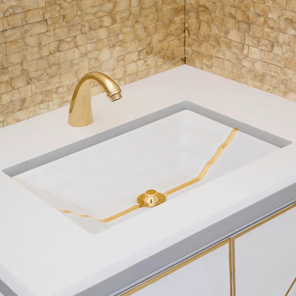 white glass with gold accent sink