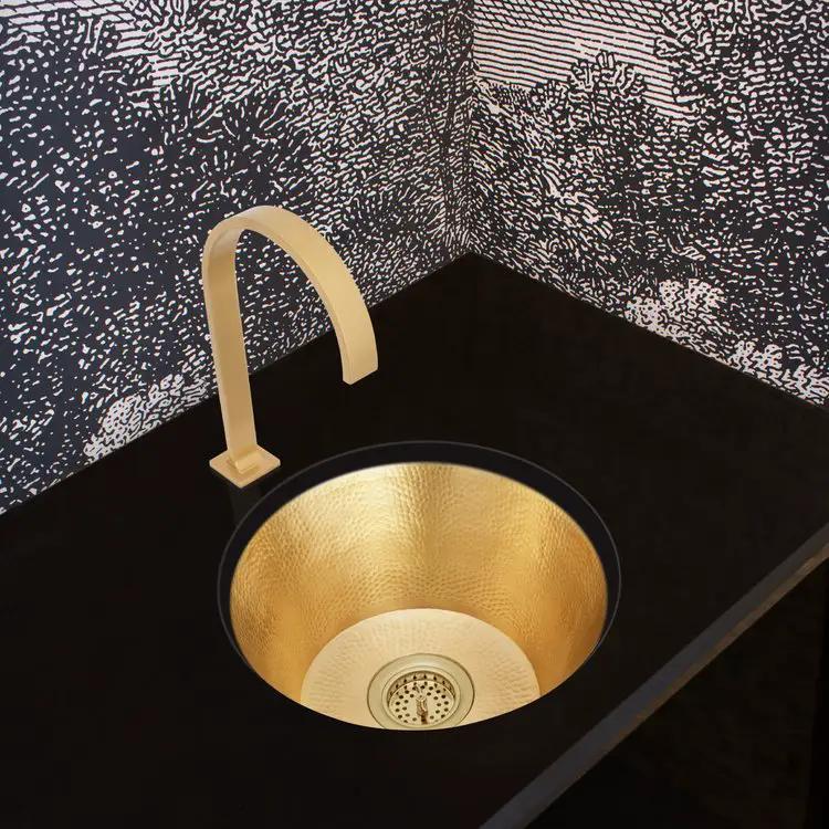 polished unlacquered brass sink