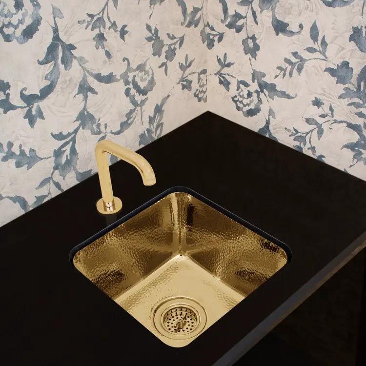 polished unlacquered brass sink