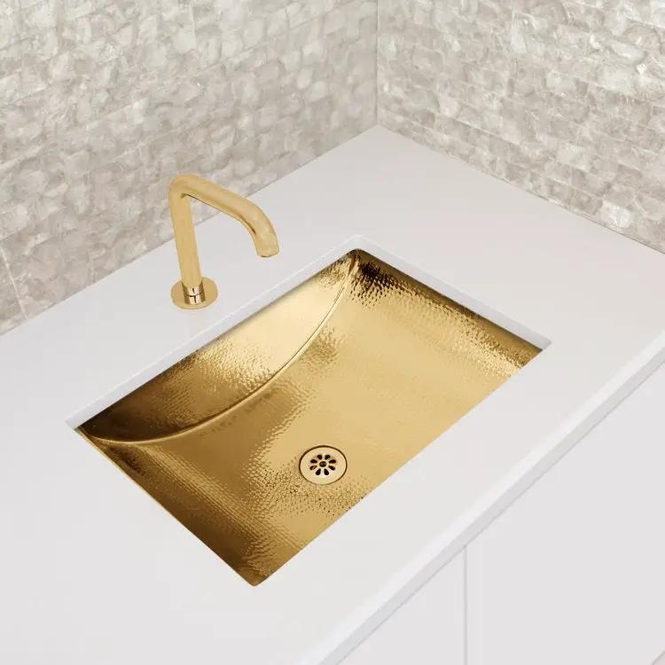 polished unlacquered brass sink