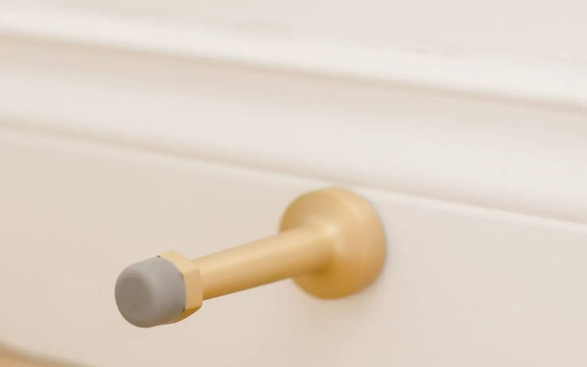 polished brass door stop