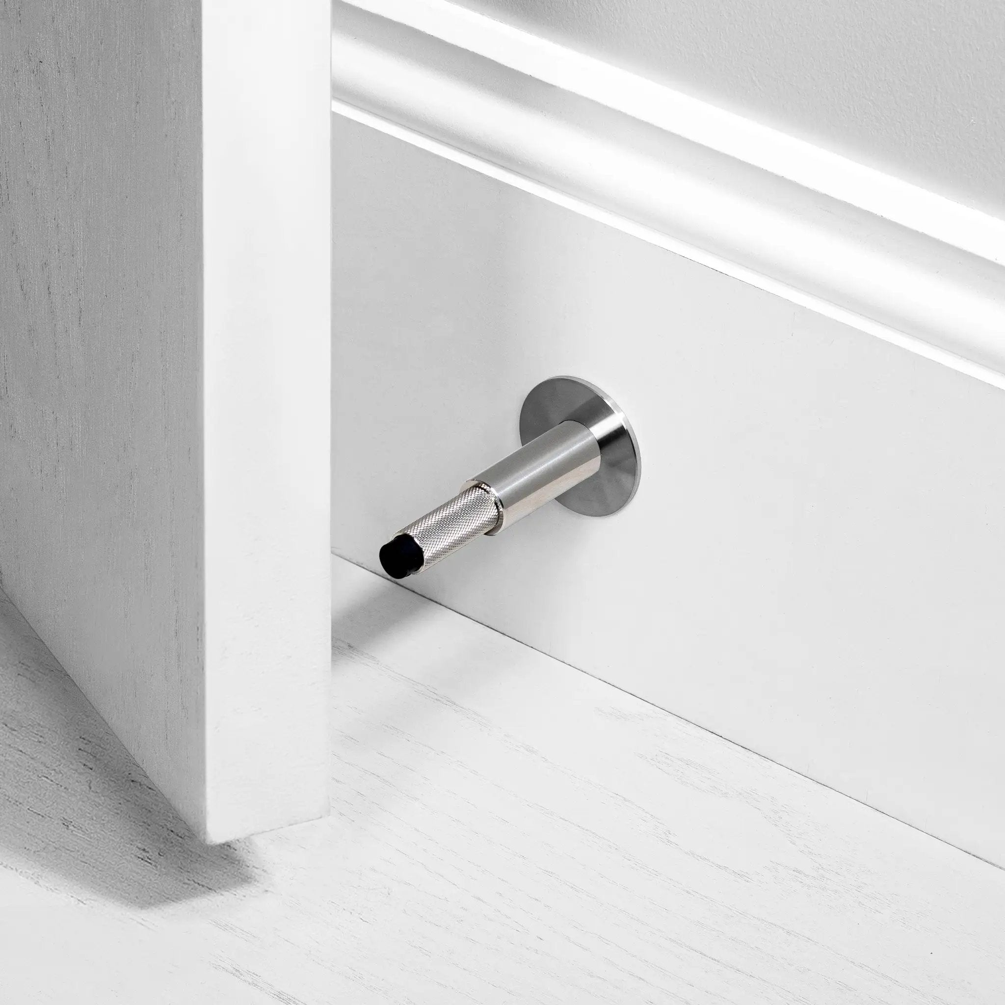 Buster + Punch Wall Door Stop by Buster + Punch