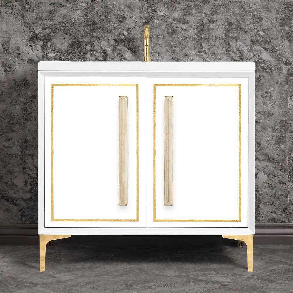 polished brass with eglomisé prism glass vanity