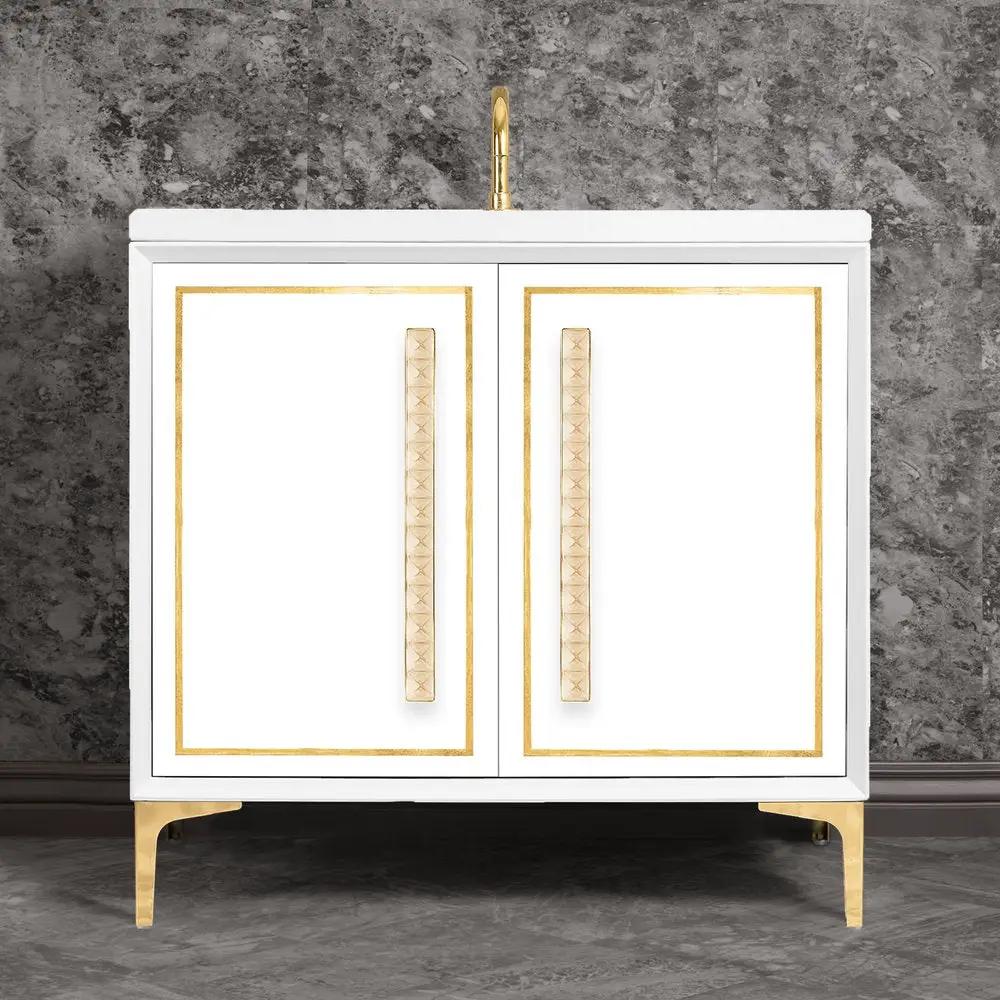 polished brass with eglomisé pyramid glass vanity