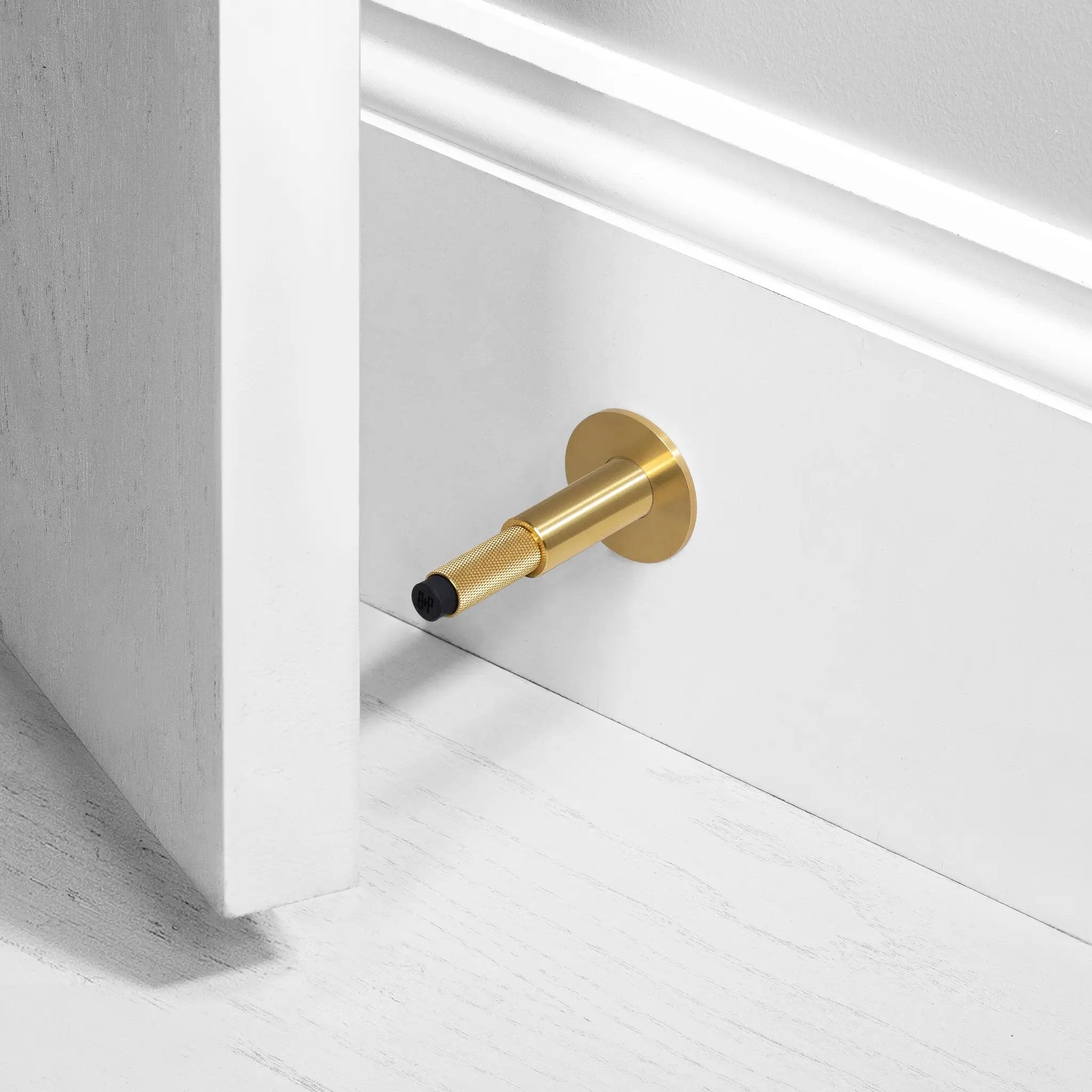 Buster + Punch Wall Door Stop by Buster + Punch