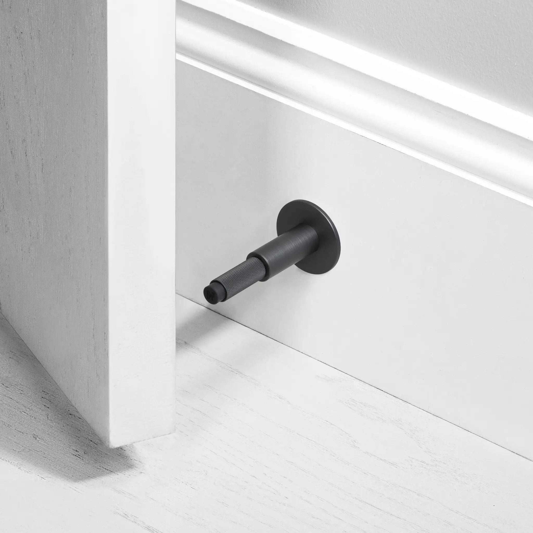 Buster + Punch Wall Door Stop by Buster + Punch
